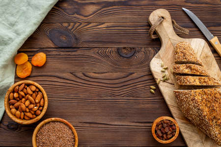 Loaf with dried fruits and nuts. Healthy homemade bread top view
