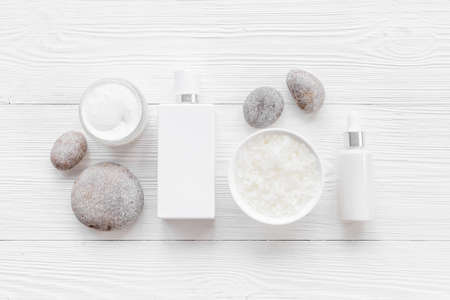 Set of white cosmetic products with bottle and tube, top view