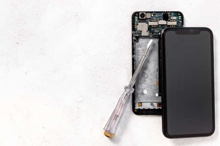 Repairing electronics circuit board - mobile phone with microchips