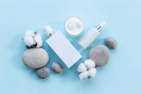 Flatlay of thite tube and bottle for cosmetic products, top viewの写真素材