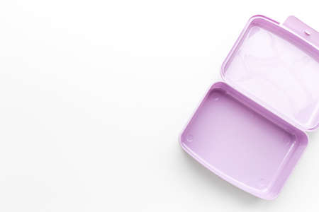 Empty plastic lunch box. Purple container for food, top view