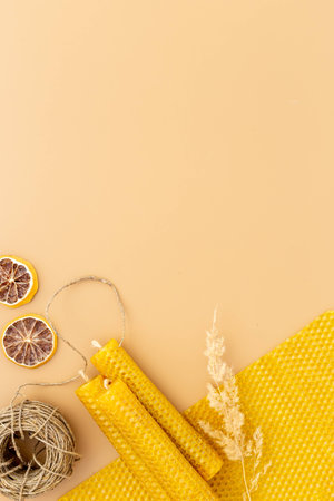 Process of making honey aroma beeswax candles with honeycombs, top viewの写真素材