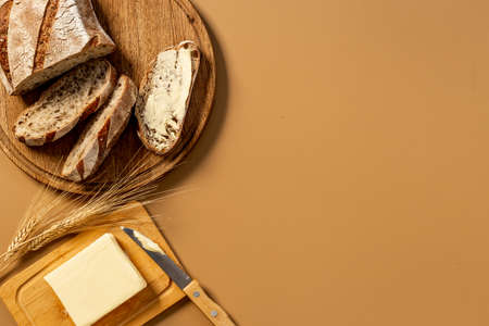 Home baked bread with butter. Healthy breakfast, top viewの写真素材