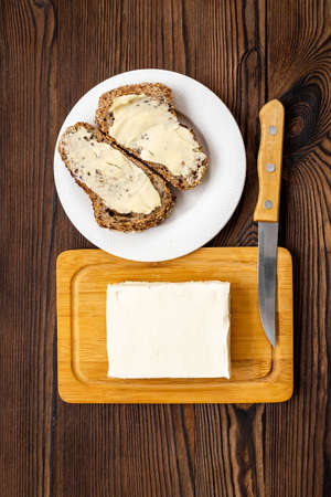 Slices of toast bread with butter. Breakfast with sandwiches
