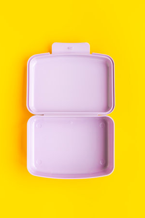 Empty plastic lunch box. Purple container for food, top view