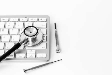 Computer with stethoscope. Tech support or repaire pc system concept