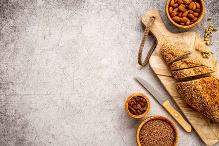 Loaf with dried fruits and nuts. Healthy homemade bread top viewの写真素材