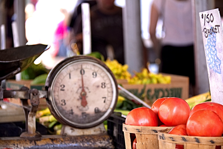 Tomato and scale at street fairの写真素材