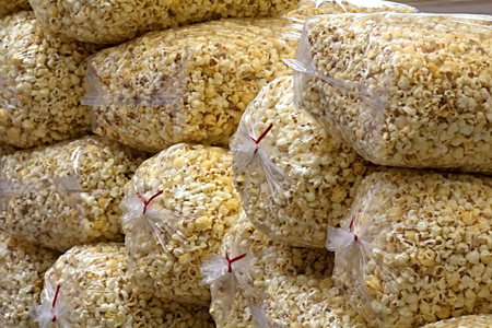 Stacked bags of popcornの写真素材