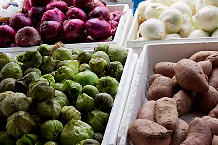 Bins of vegetables at street marketの写真素材