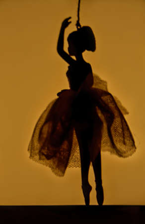 Silhouetted ballerina on wireの写真素材