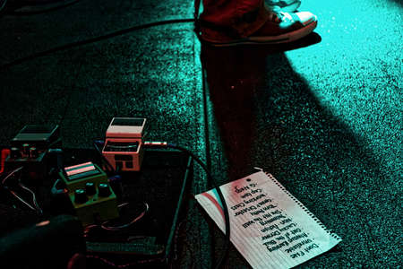 Stage with guitar pedals and set listの写真素材