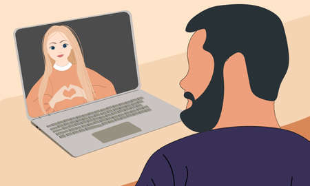 The man speaks via video chat with his lover. Valentine's day at a distance.