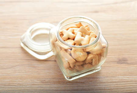 A bottle of alphabet cookiesの写真素材