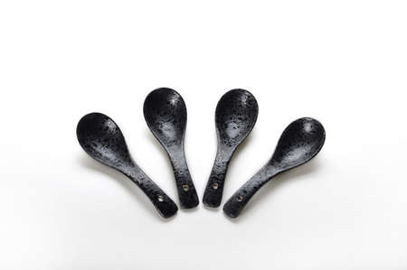 4 Black ceramic spoonの写真素材