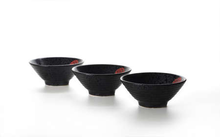 A row of Black ceramic bowlの写真素材