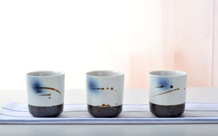 Three hand-painted tea cupsの写真素材