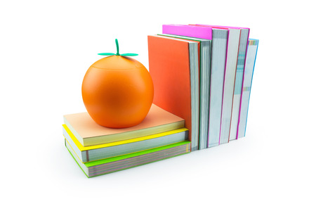 Books and orange isolated on white backgroundの写真素材