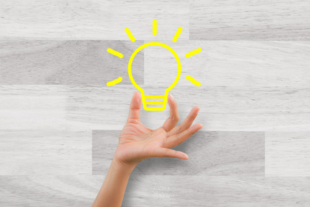 Woman handle idea with wooden backgroundの写真素材