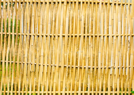 old, grunge bamboo wall used as backgroundの写真素材