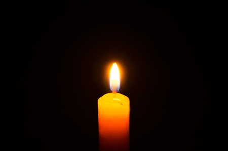 Candle light in the darkの写真素材