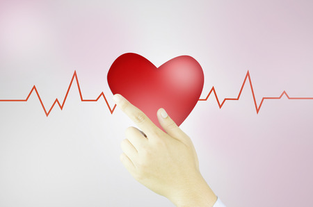 Human hand writes heart and graphの写真素材