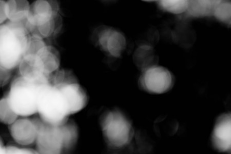 background black abstract bokeh for christmas night light holidayの写真素材