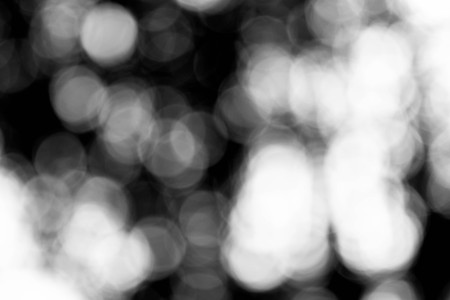 background black abstract bokeh for christmas night light holidayの写真素材