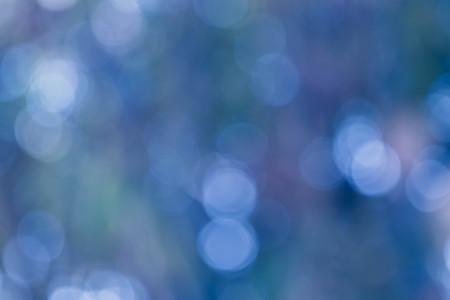 Bokeh in a blue natural background, defocusedの写真素材