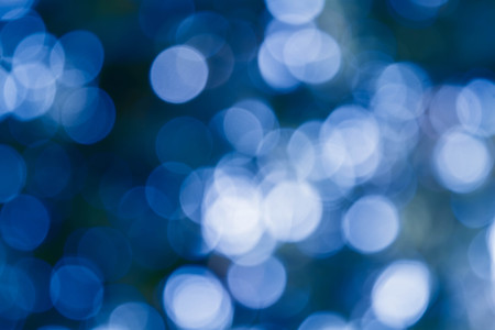 Bokeh in a blue natural background, defocusedの写真素材