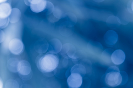 Bokeh in a blue natural background, defocusedの写真素材