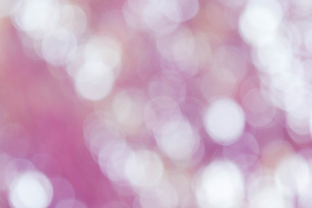 bokeh background with abstract blurred foliage and bright summer sunlightの写真素材