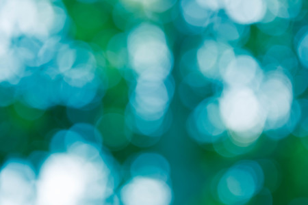 Bokeh in a blue natural background, defocusedの写真素材