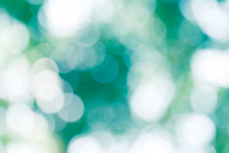 Bokeh in a blue natural background, defocusedの写真素材