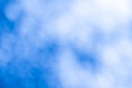 Bokeh in a blue natural background, defocusedの写真素材