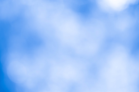 Bokeh in a blue natural background, defocusedの写真素材