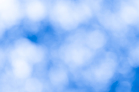 Bokeh in a blue natural background, defocusedの写真素材