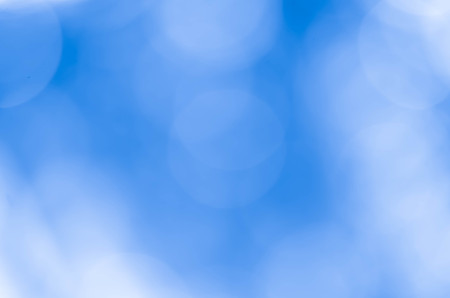 Bokeh in a blue natural background, defocusedの写真素材