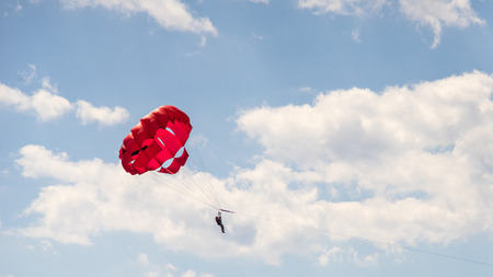 Riding on a parachute behind a boat Among the popular beach activities. One of the most popular sea activities.の写真素材