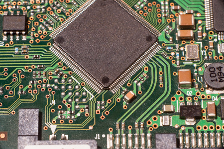 Close up of electronic circuit board with microchip and componentsの写真素材