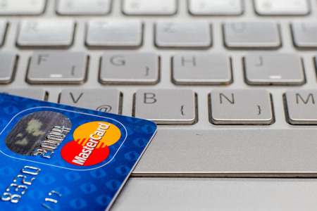 Sarajevo, Bosnia and Herzegovina - January 25 , 2017: closeup of credit card MasterCard. On laptop keyboard.のeditorial素材