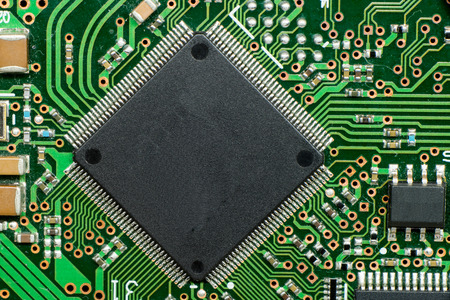 Close up of electronic circuit board with microcontroller and components