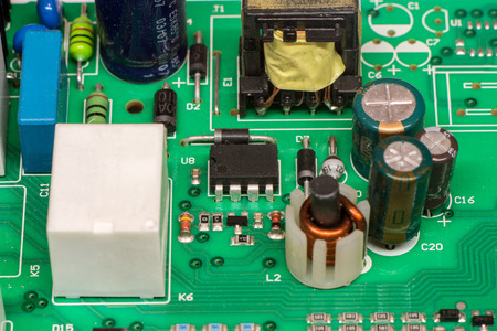 green multi layer printed electronic circuit board with microcontroller and components