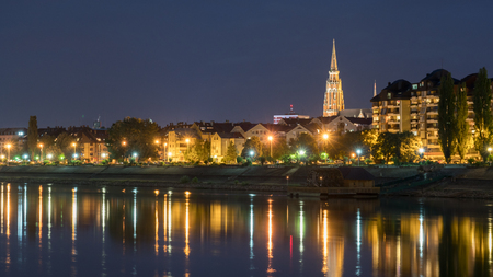 River Drva coast reflection by night in city Osijek, Croatiaのeditorial素材