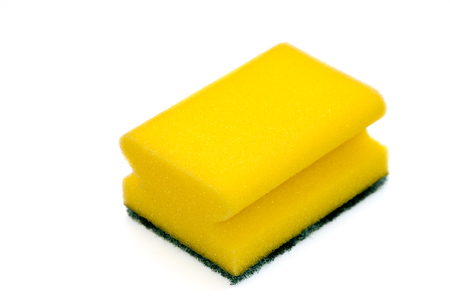 Dish washing sponge, felt horizontally and isolated on white backgroundの写真素材