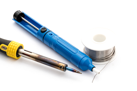 Soldering iron and wire. Desoldering vacuum pump. Isolated on white background. Electronic repair equipment.の写真素材