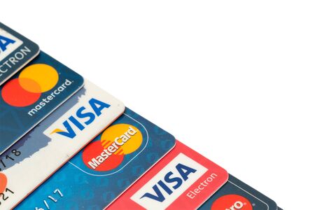 Sarajevo, Bosnia and Herzegovina - March 04, 2018: closeup pile of credit cards, Visa and MasterCard, credit, debit and electronic, isolate on white background with clipping pathのeditorial素材