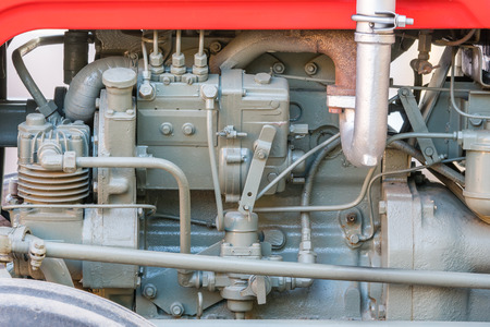 Detail of old tractor machine or engine. Whit visible fuel pump, air compressor, fuel filter and exhaust pipe.の写真素材