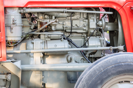 Detail of tractor machine or engine. Whit visible fuel pump, engine starter, oil filter and generator.の写真素材