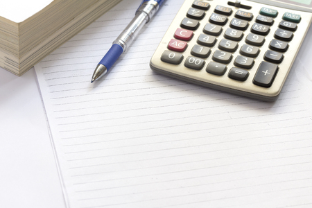 pen and calculator on table. shallow depth of fieldの写真素材